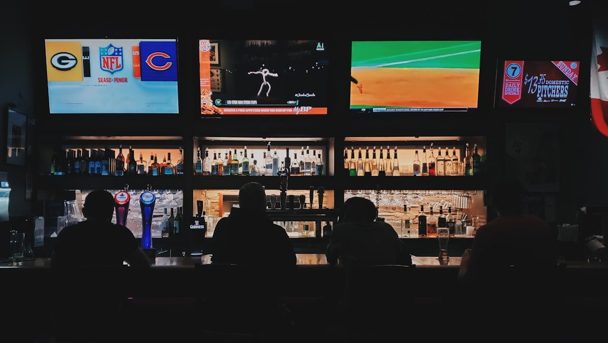 Fans watching a match on flat-screen monitors